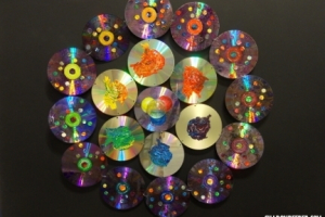 Big Bang Mandala, 22 x 22 x 1 inch, acrylic paint, compact disks, steel, snow globe toy